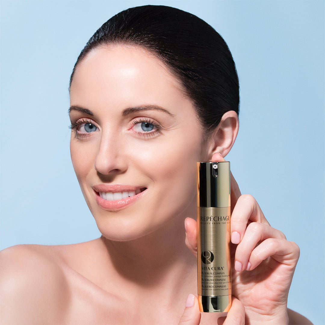 Model women holding Vita Cura® B3 Serum Complex